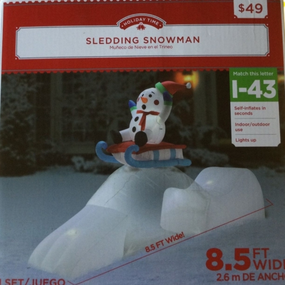 Holiday Time Snowman on Sled Inflatable with Blue and Red Accents